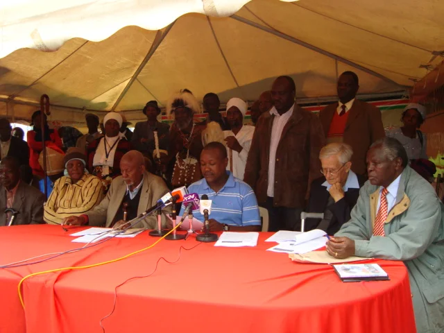 Tom Kagwe (centre)of the KHRC and Gitu wa Kahengeri (left), spokesperson of the MMWVA address the media during a pre-departure press conference on July 7,2012