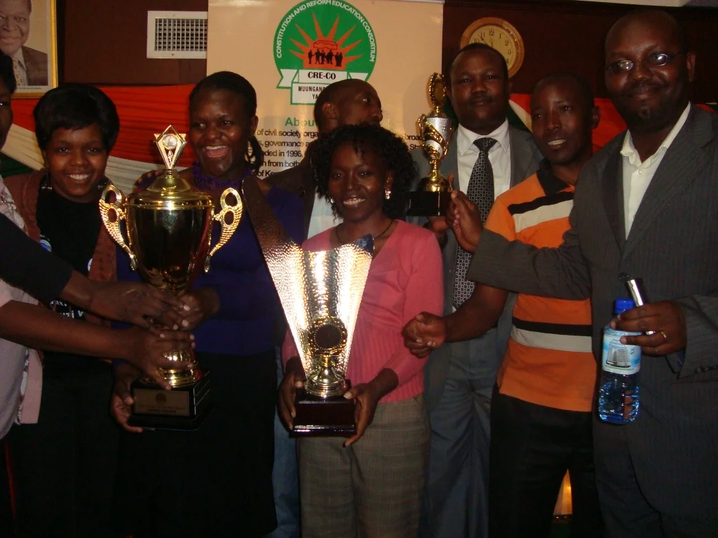 KHRC staff and friends celebrate the KHRC’s win of the Overall Award and two other awards during the CRECO CSOYA ceremony held at the Nairobi Safari Club, Wednesday 14 2011.
